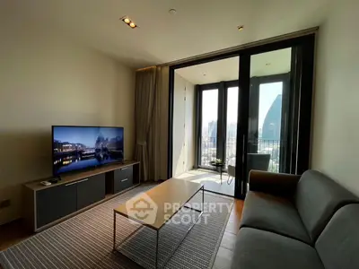 Modern living room with sleek furniture and city view balcony, perfect for urban living.