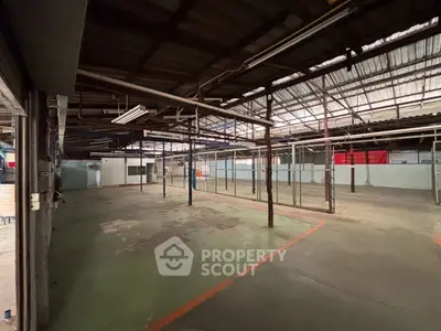 Spacious industrial warehouse with high ceilings and open layout for versatile use.