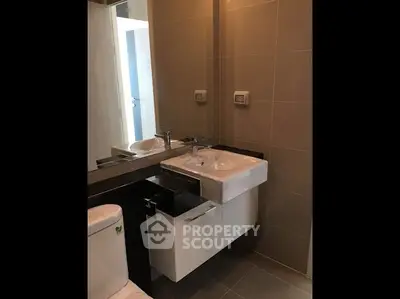 Modern bathroom with sleek sink and mirror design