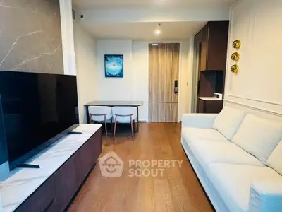 Modern living room with sleek furniture and stylish decor in a contemporary apartment.
