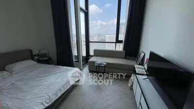 Modern bedroom with stunning city view and sleek furnishings