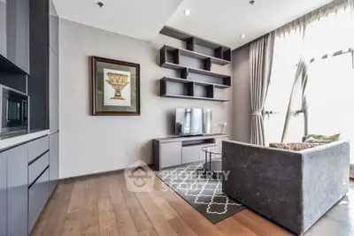 Modern living room with stylish shelving and large windows in a contemporary apartment.