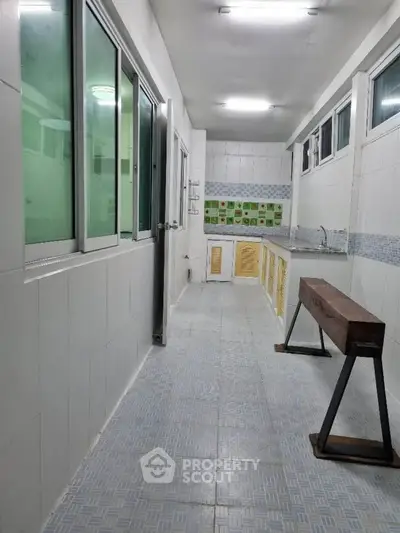 Spacious kitchen with closed layout and ample natural light