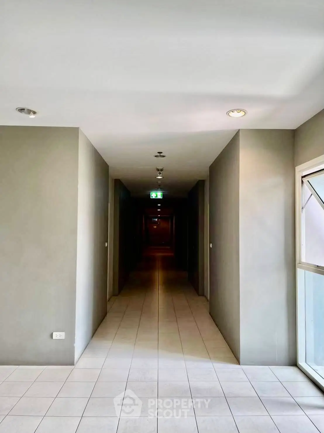 Modern apartment corridor with sleek design and ample lighting