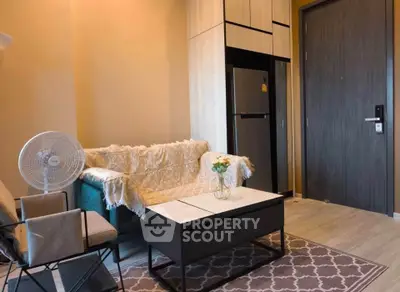 Cozy living room with modern furniture and stylish decor in a contemporary apartment.
