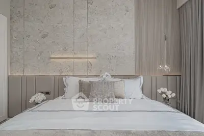 Luxurious modern bedroom with elegant decor and plush bedding