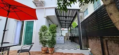 Charming outdoor patio with modern design and lush greenery