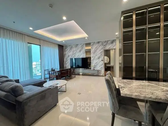 Luxurious modern living room with elegant marble accents and spacious open layout.