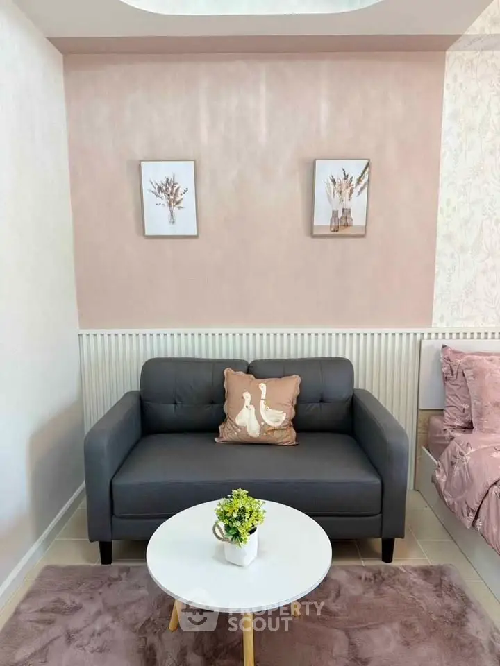 Charming living room with cozy sofa and elegant decor, perfect for relaxation and style.