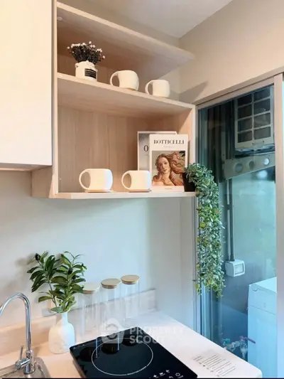 Modern kitchen with sleek induction cooktop and stylish open shelving