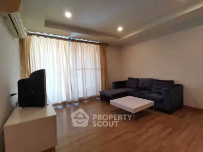 Spacious living room with modern sofa and natural light