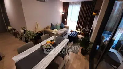 Stylish living room with elegant dining area and cozy seating, perfect for modern living.