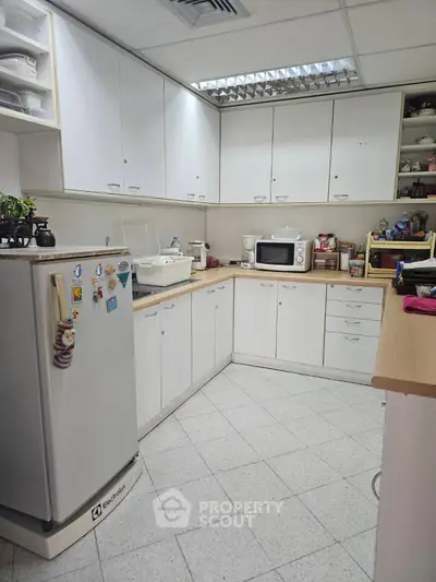 Spacious kitchen with ample storage and modern appliances