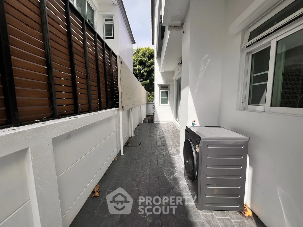 Modern outdoor laundry area with washing machine and sleek design