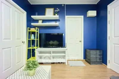 Charming living room with vibrant blue walls and modern decor
