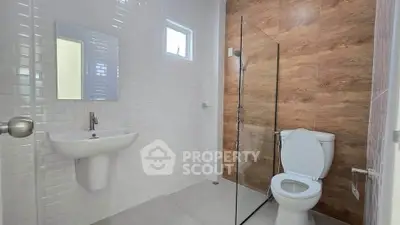 Modern bathroom with sleek design and glass shower partition