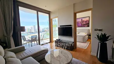 Luxurious living room with stunning city view and spacious balcony