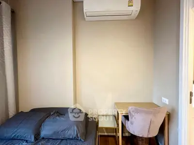 Cozy bedroom with modern air conditioning and stylish desk setup.
