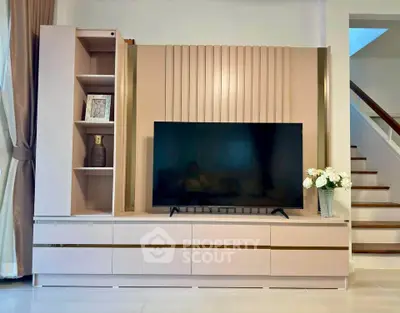 Modern living room with sleek TV unit and elegant decor