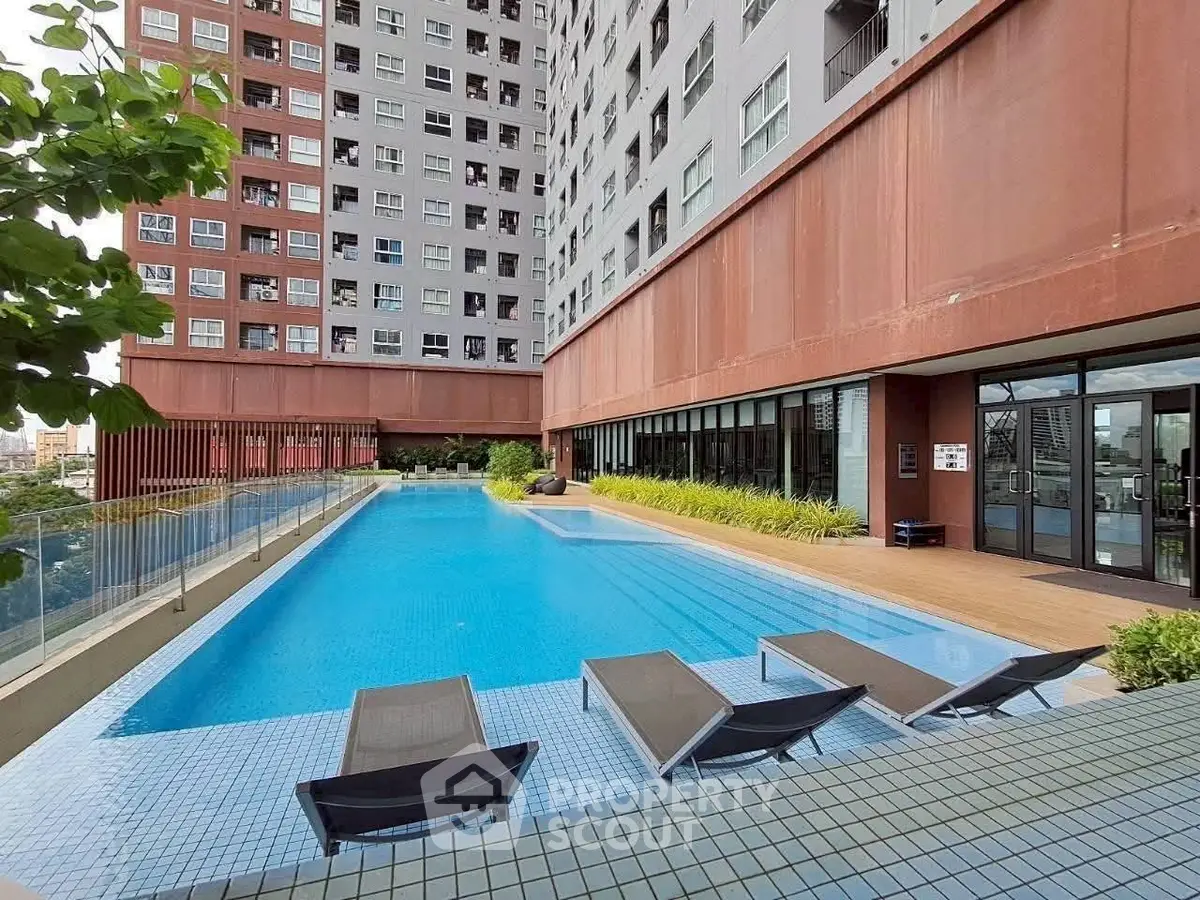 Luxurious apartment complex with stunning outdoor pool and modern amenities.