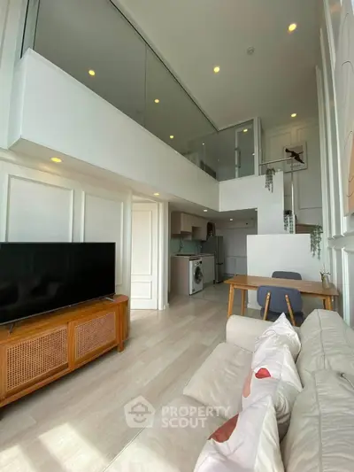 Modern loft apartment with high ceilings, open layout, and stylish decor