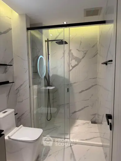 Luxurious modern bathroom with marble walls and sleek shower design