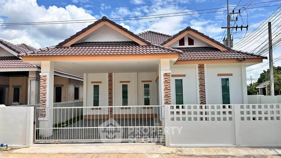 Charming single-story house with modern design and spacious driveway in a serene neighborhood.