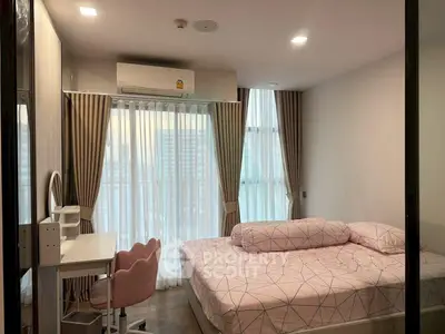 Modern bedroom with large windows, stylish curtains, and cozy bed in a high-rise apartment.