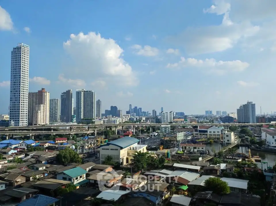 Stunning cityscape view with modern skyscrapers and residential area under a clear blue sky.