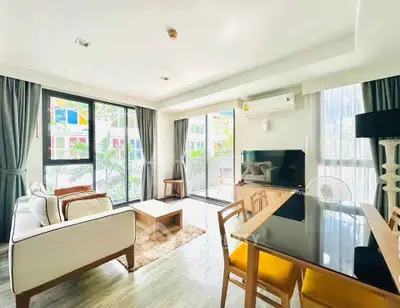 Bright and modern living room with large windows and stylish furniture