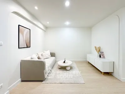 Modern minimalist living room with neutral tones and stylish decor