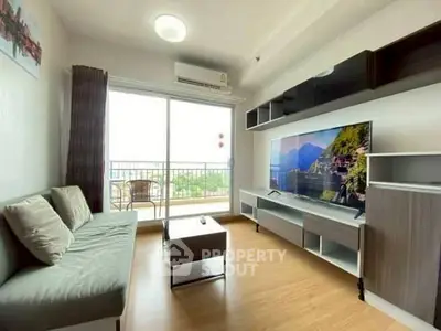Modern living room with large window and scenic view, featuring stylish furniture and decor.