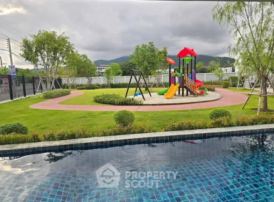 Stunning residential playground and pool with scenic mountain views.