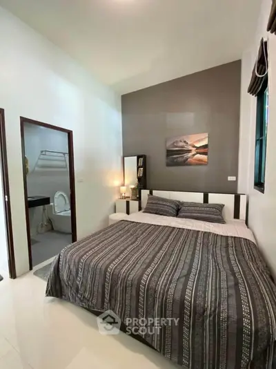 Cozy bedroom with ensuite bathroom and modern decor