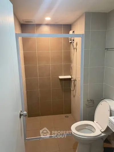 Modern bathroom with walk-in shower and sleek tile design