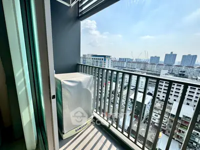 Modern balcony with city view and air conditioning unit in high-rise apartment