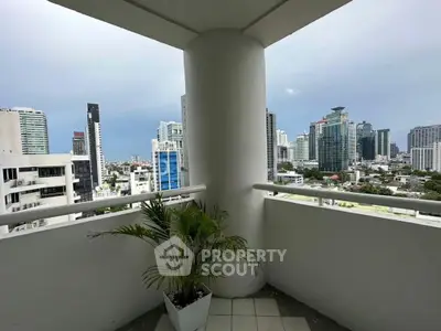 Spacious balcony with stunning city skyline view, perfect for relaxation and enjoying urban living.