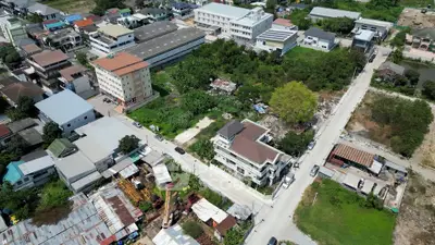 Aerial view of a residential neighborhood with diverse buildings and greenery.