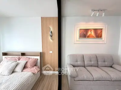 Modern living room with cozy sofa and stylish decor in a contemporary apartment.