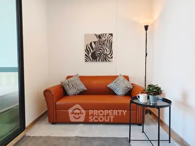 Cozy living room with leather sofa and modern decor