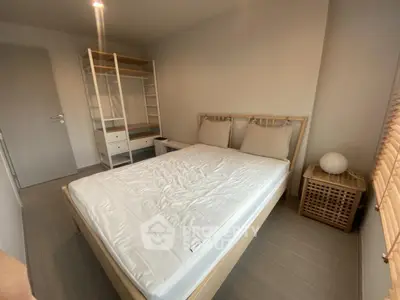 Cozy minimalist bedroom with wooden bed frame and modern wardrobe