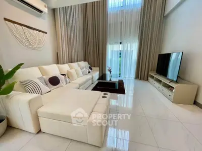 Luxurious modern living room with high ceilings and elegant decor