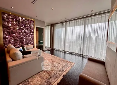 Luxurious living room with panoramic city view and elegant decor.