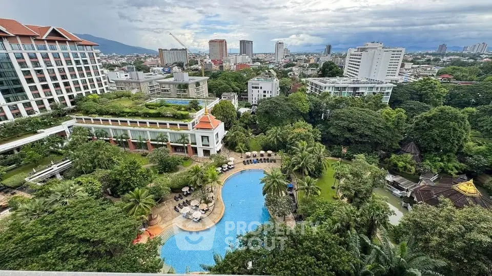 Stunning aerial view of luxury pool and lush gardens in urban setting