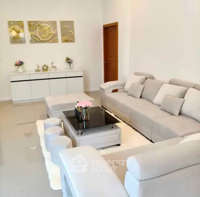 Elegant living room with modern decor and plush seating, perfect for relaxation and entertaining.