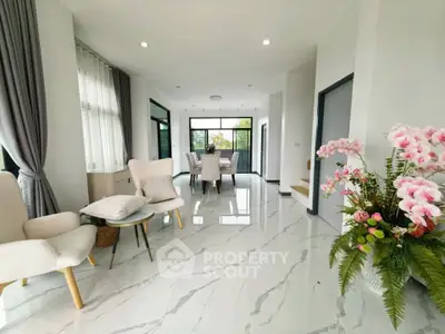 Spacious modern living room with elegant decor and large windows