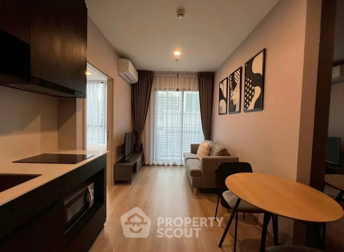 Modern living room with stylish decor and open kitchen layout