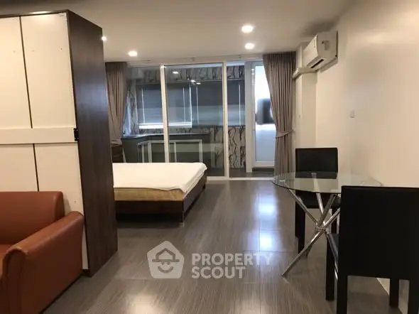 Modern studio apartment with open layout and sleek furnishings