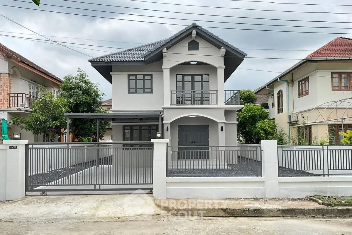 Charming two-story house with modern facade and spacious driveway in a serene neighborhood.