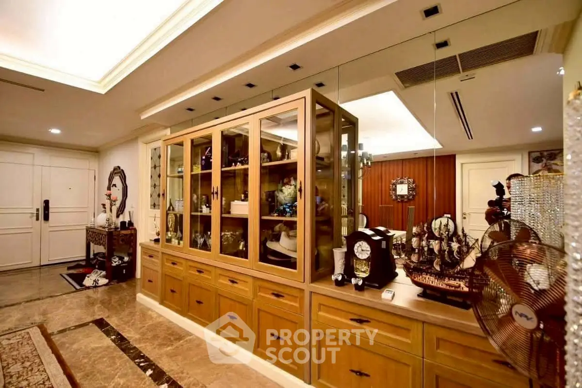 Luxurious hallway with elegant cabinetry and decorative accents in a high-end residence.